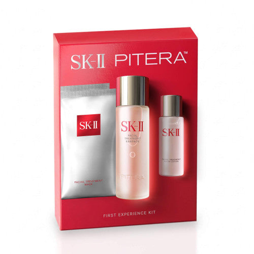 SK-II First Experience Kit products arranged side by side with essence bottle centered and smaller lotion and mask beside it