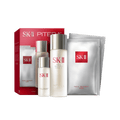 SK-II First Experience Kit items including facial treatment essence bottle, clear lotion bottle, and sheet mask sachet on a light background