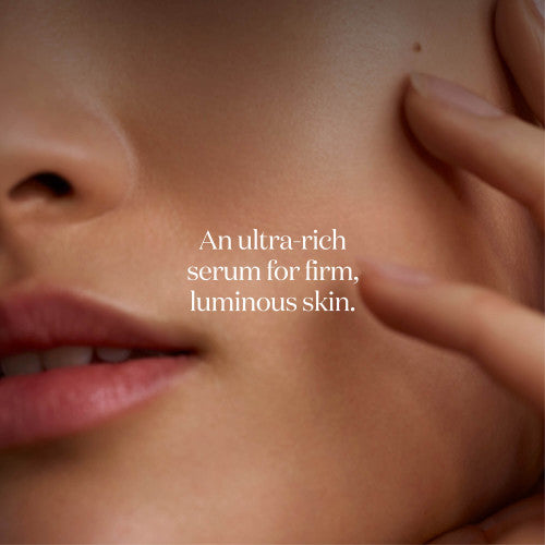 Close-up of a person's neck with text overlay about an ultra-rich serum for skin.