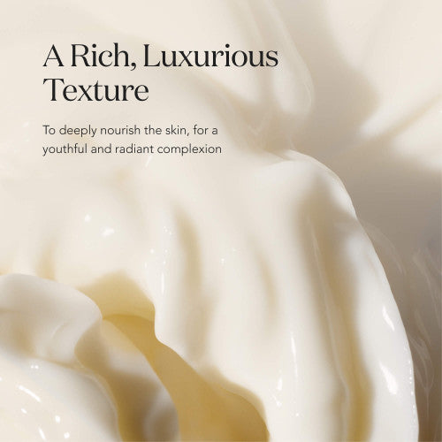 Close-up of SK-II LXP Ultimate Revival Cream texture with smooth, glossy folds of cream on a soft neutral background