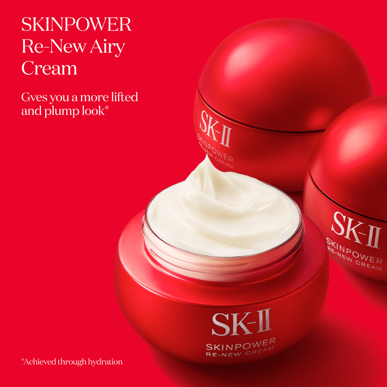 SK-II SKINPOWER Re-New Airy Cream jar opened to show white cream with additional closed jars behind on a red background