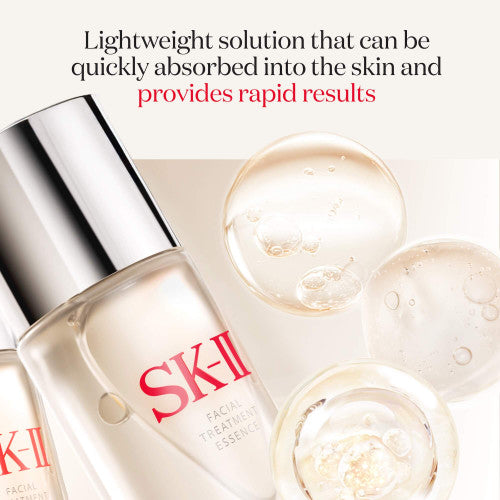 SK-II facial treatment essence with droplets on a white background