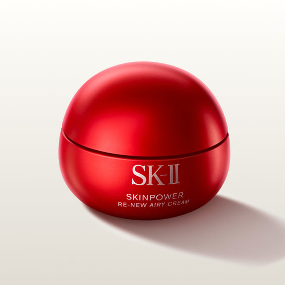 SK-II SKINPOWER Re-New Airy Cream jar in red packaging placed on a light background with a soft shadow
 