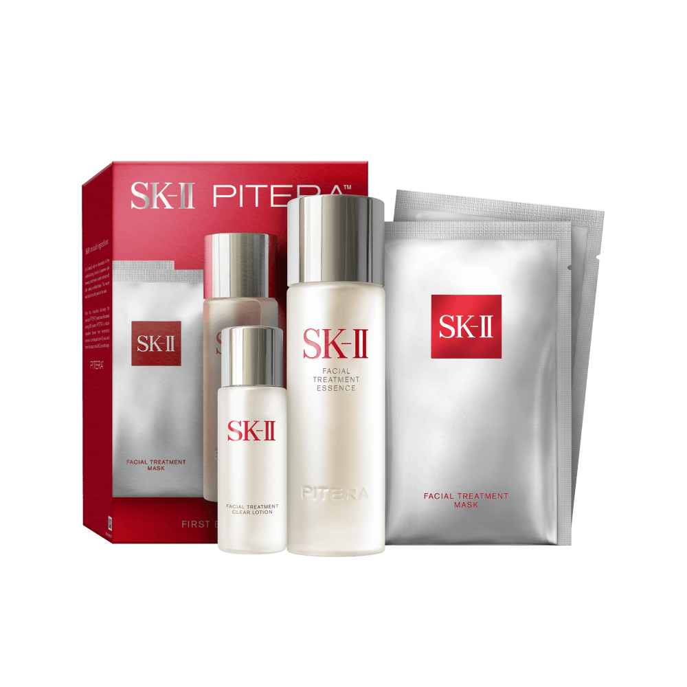 SK-II First Experience Kit displayed inside a red box with essence bottle, clear lotion, and sheet mask arranged neatly