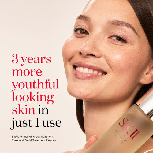 Woman smiling with SK-II Facial Treatment Essence, 3 years more youthful looking skin in just 1 use