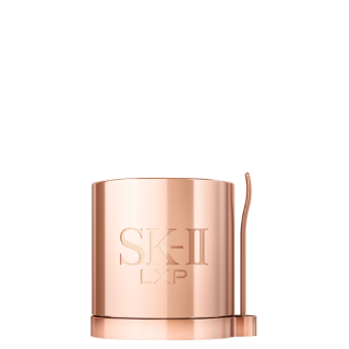 SK-II LXP Ultimate Revival Cream jar in metallic gold placed against golden liquid texture background
 