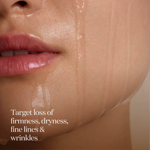 Close-up of SK-II LXP Ultimate Revival Essence applied on cheek with liquid texture visible across the skin