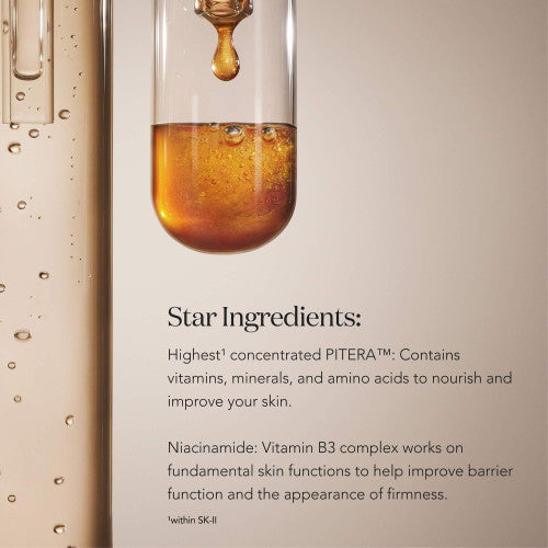 Glass dropper releasing amber liquid into a transparent vial with bubbles on a neutral beige background