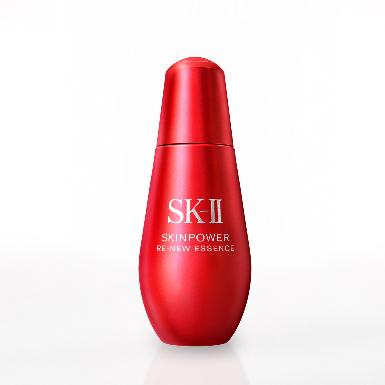 Close-up of SK-II SKINPOWER Re-New Essence bottle showing smooth curved red surface on a light background
