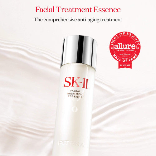 SK-II Facial Treatment Essence bottle in frosted glass with silver cap on a soft flowing background with circular award badge