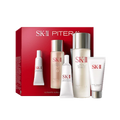 SK-II Pitera Ultimate Aura Essentials Kit with multiple bottles and tubes arranged in front of a red product box on a transparent background