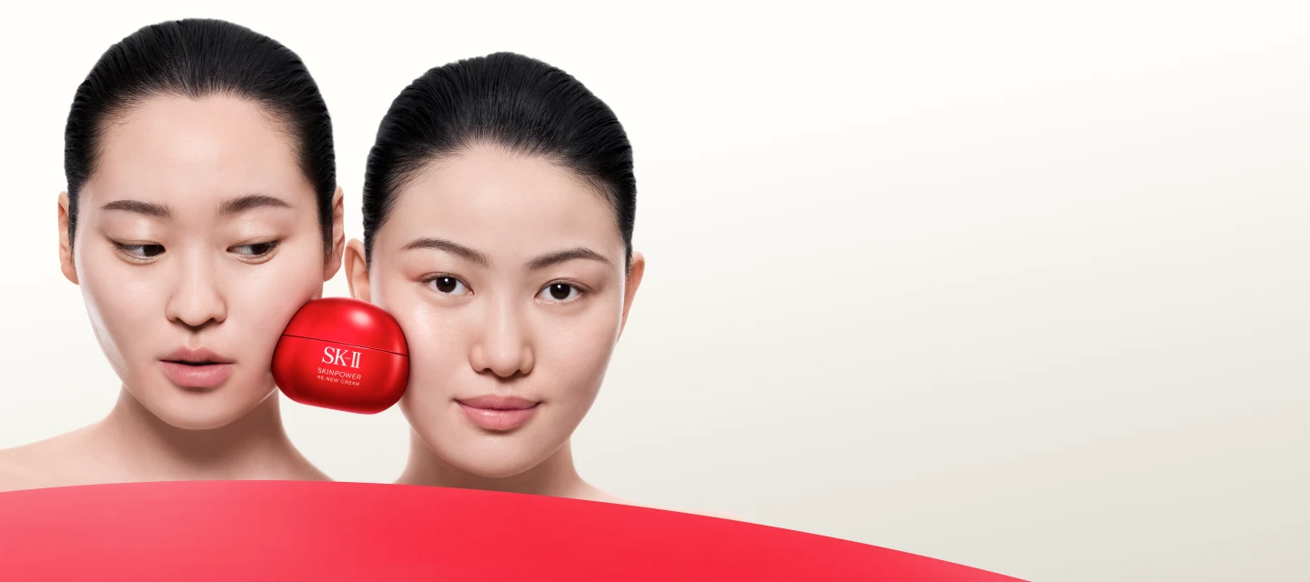 Two faces side by side with SK-II Skinpower cream jar placed near face on light background
 