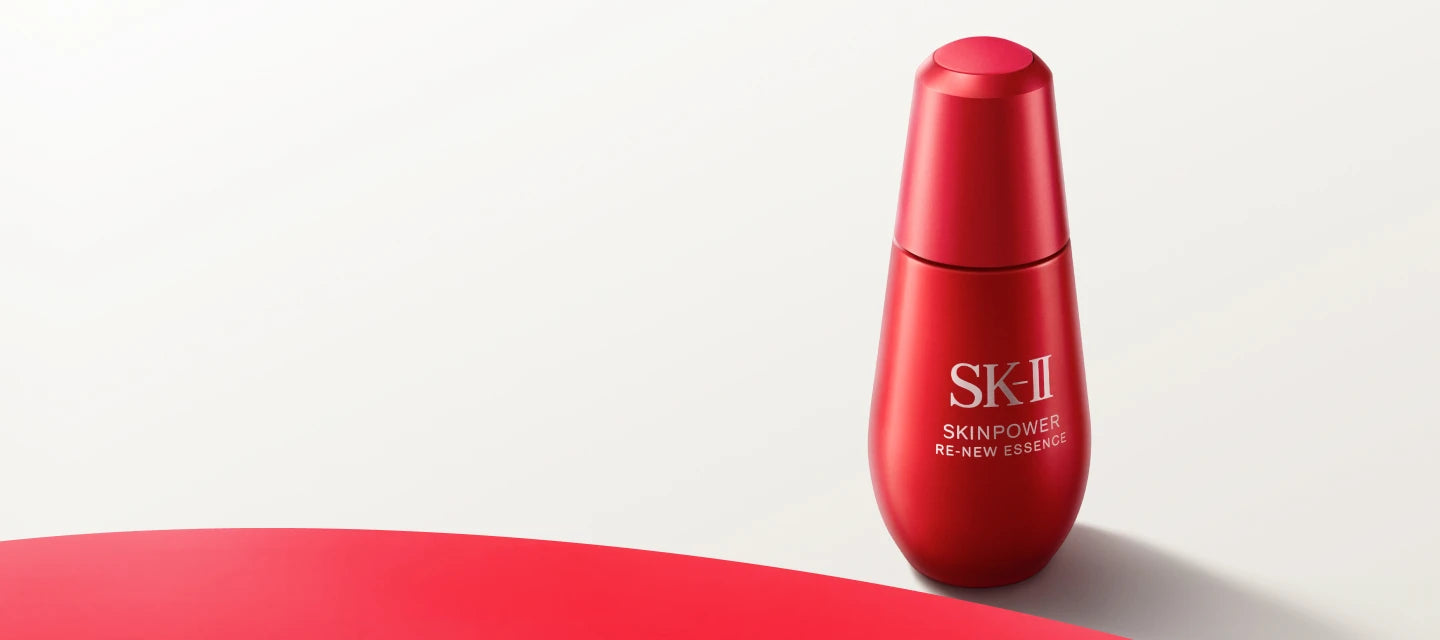 Red SK-II skincare bottle on a white background